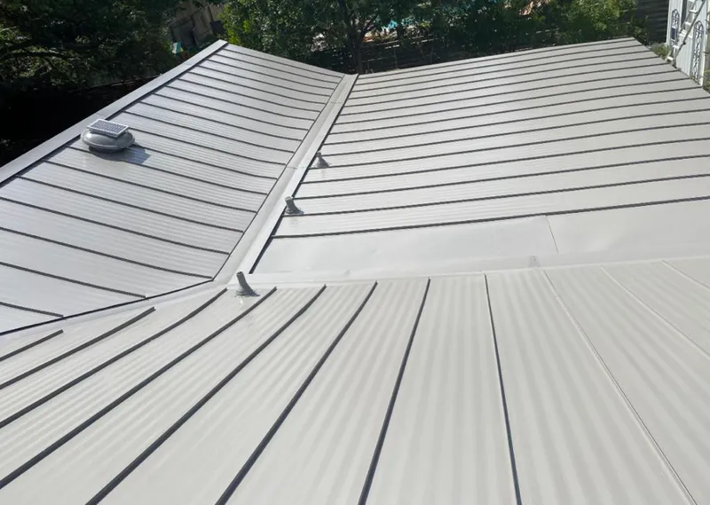 Solar attic fan installed on a metal roof for Roof Ventilation in Hoover